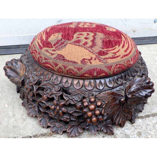 607 - A carved footstool, non symetrical pattern