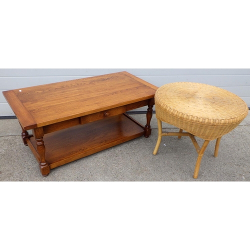 610 - An oak coffee table, 105cm long together with a wicker occasional table (2)