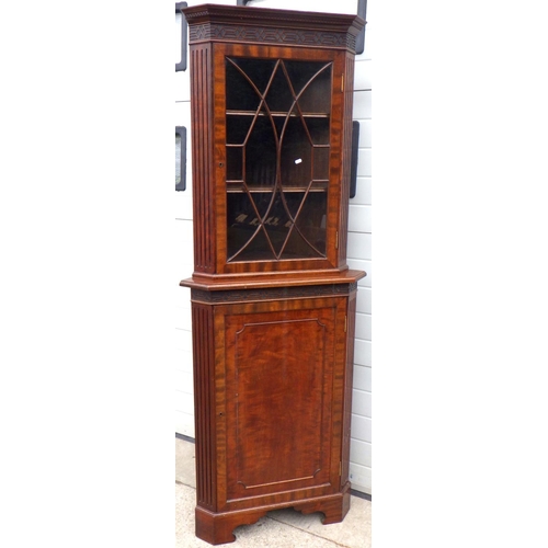 621 - A tall mahogany corner cabinet, missing moulding, 207cm tall