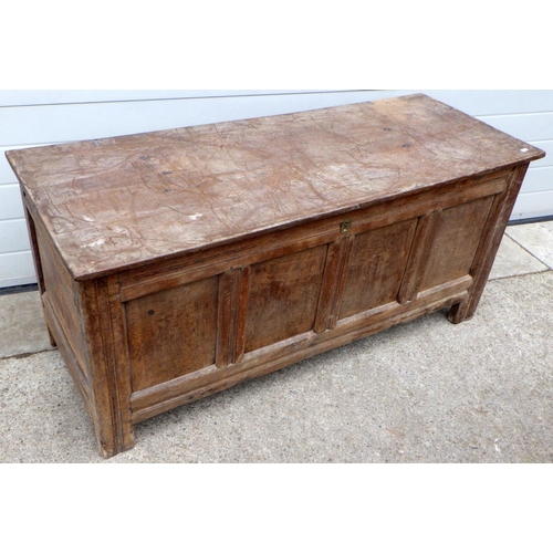 629 - A four panel oak coffer, faded, 140cm wide