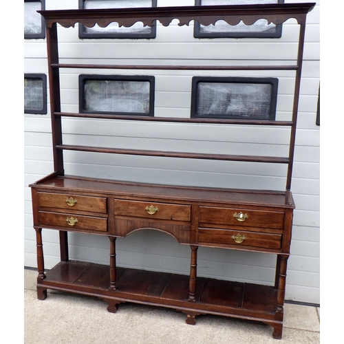 635 - An oak dresser with a rack & pot board, 190cm wide