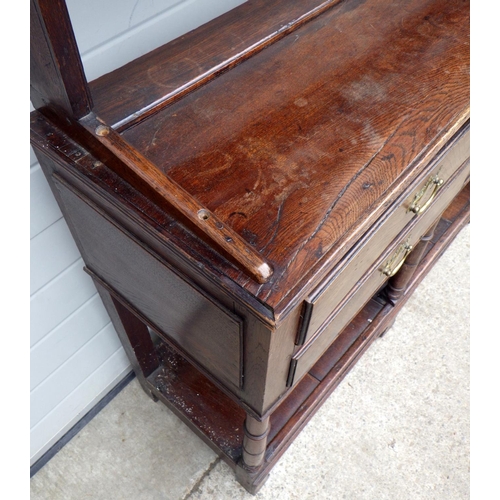 635 - An oak dresser with a rack & pot board, 190cm wide