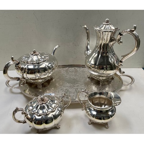 86 - A four piece silver plated tea set together with an oval tray