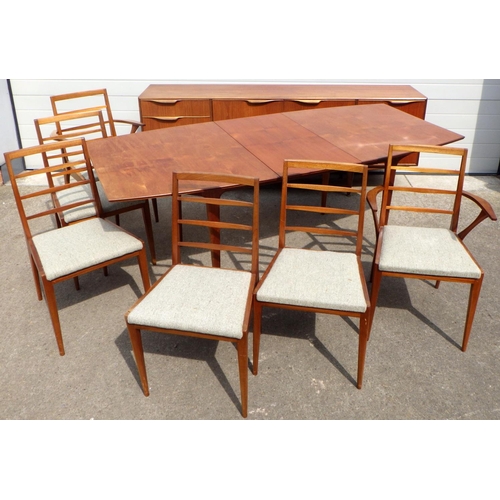 675 - A McIntosh teak extending dining table with one leaf & sideboard, together with six chairs, one with... 