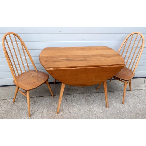 A blonde Ercol drop leaf dining table with pair of chairs (3)