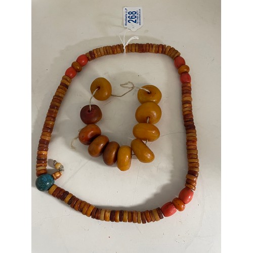 268 - An Oriental mixed bead necklace, the blue craquele style bead approx 20mm diameter; a string of irre... 