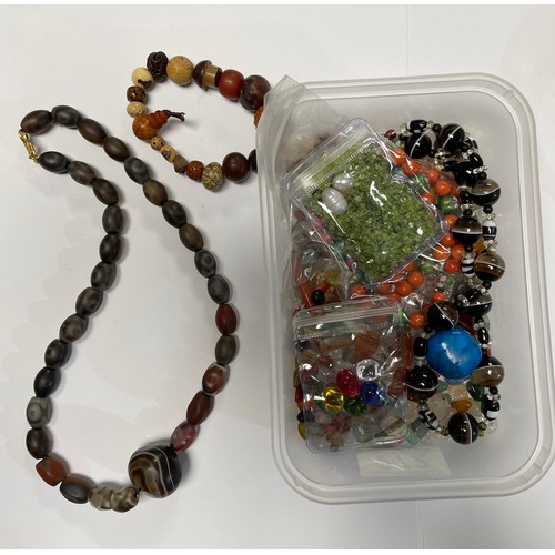 272 - Loose specimen stone beads; a stone bead necklace; an elasticated bracelet comprising nuts etc.