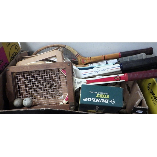 129 - A group of vintage rackets, balls and advertising tins (2)