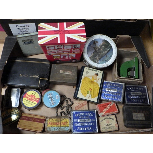 129 - A group of vintage rackets, balls and advertising tins (2)