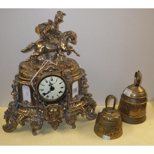 158 - A brass striking 8 day mantle clock together with two bells