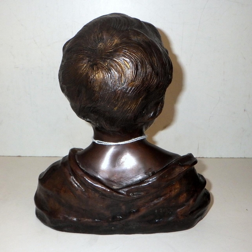 299 - A small bronze bust 21cm tall, stamped 1305