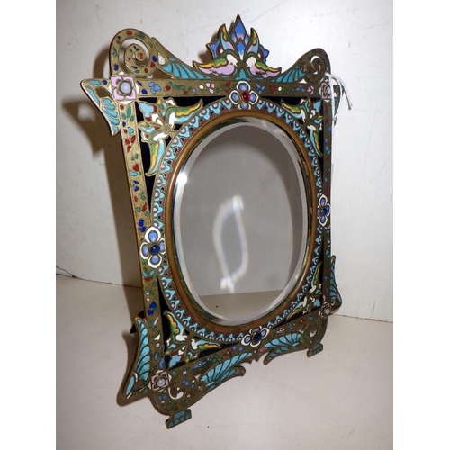 325 - A standing vanity mirror comprising a rectangular frame with an oval plate, brass with cloisonné ena... 