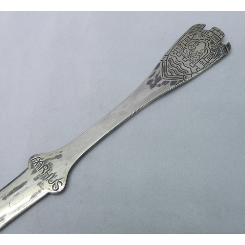 10 - A Danish cabinet spoon “Mary Help Us…”, Anton Michelsen, Denmark, white metal having cast and engrav... 