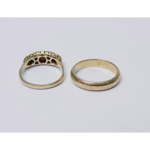 46 - A 9ct gold band ring; a 9ct gold ring set with garnets (a/f, stones abraded and chipped, setting and... 