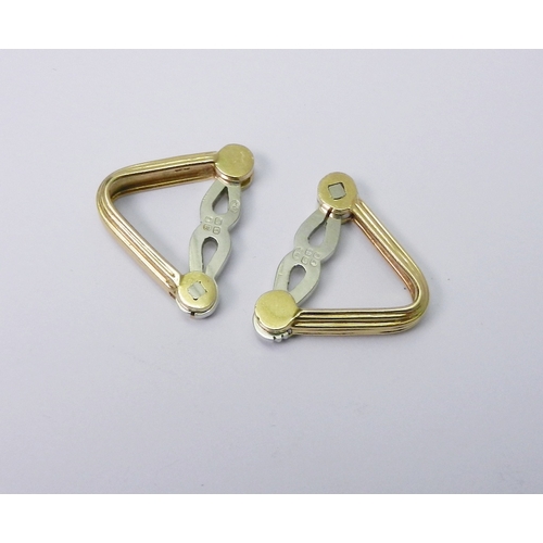 48 - Two matching triangular clips, 18ct yellow and white gold bearing the London sponsor's mark 