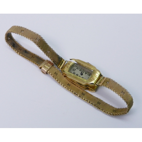49 - A ladies bracelet watch comprising an18ct gold rectangular head containing a manual wind mechanical ... 