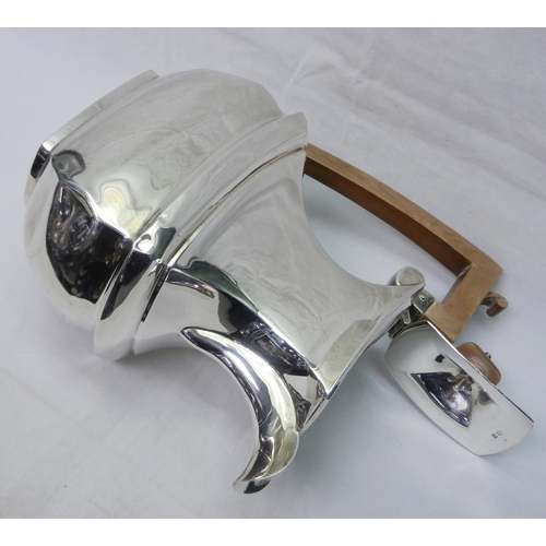 5 - A silver hot water jug having a hardwood handle, early 20th cent, a/f dented.  220mm tall to handle ... 