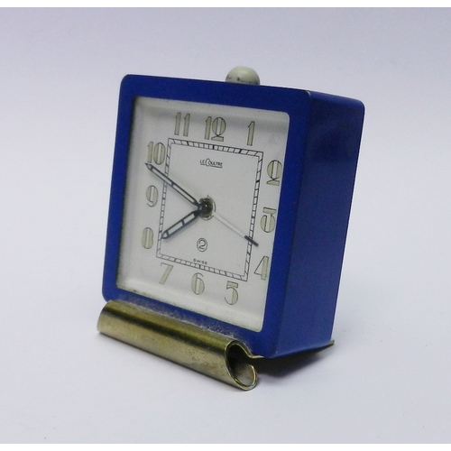 82 - A LeCoultre 2 Day alarm clock having a manual wind movement in a blue finished base metal square cas... 