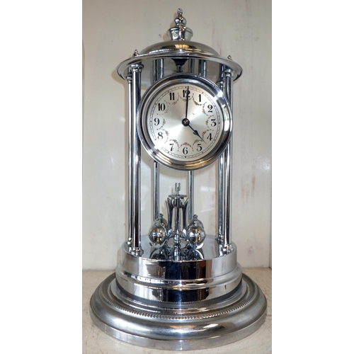 202 - A large plated anniversary clock in a glass dome 44cm tall af