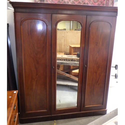 876 - A Victorian mahogany triple wardrobe, cornice missing back corner, 200cm wide