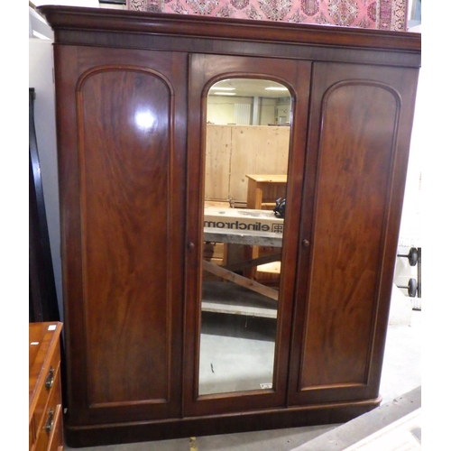 876 - A Victorian mahogany triple wardrobe, cornice missing back corner, 200cm wide