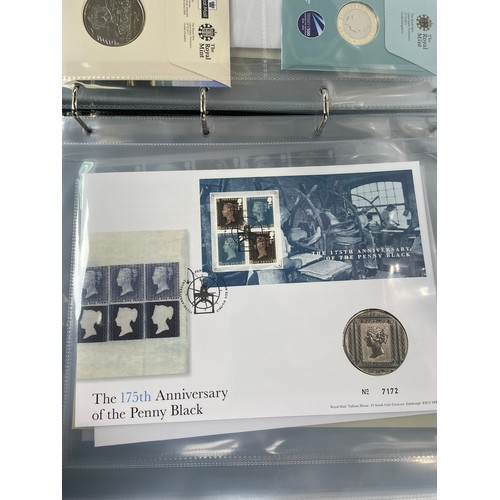 165 - Royal Mail / Royal Mint Philatelic Numismatic Covers: two slip-cover albums containing approximately... 