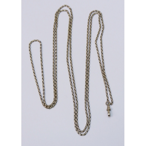 105 - A closed loop guard / muff chain, yellow metal marked 9c, the clip marked 