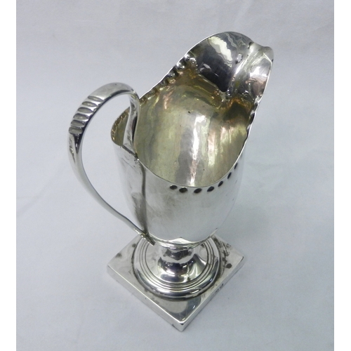 24 - George III and later silver: a helmet creamer, London 1809, spout a/f, 150mm tall; a sifter spoon; a... 