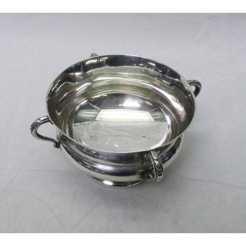 26 - An Arts & Crafts influence silver four-handled presentation bowl, Edward Barnard & Sons, London 1909... 