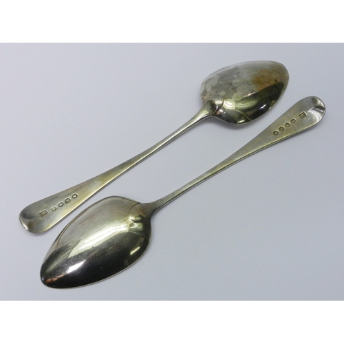 36 - A pair of George III silver old english pattern table spoons, Samuel Godbehere, Edward Wigan, James ... 