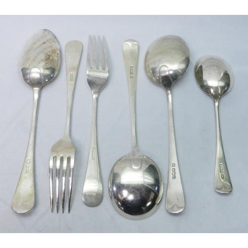 38 - 20th cent old english pattern cutlery comprising in hallmarked silver a pair of soup spoons, a pair ... 