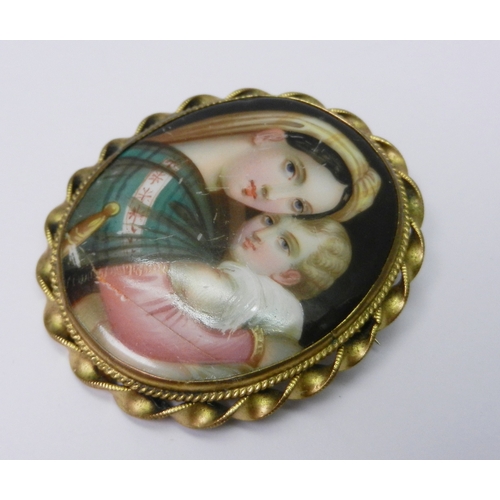66 - A cameo pendant in a white metal mount marked 935, 45mm long incl suspension loop; a cameo bracelet;... 