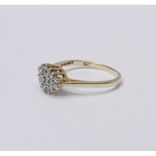74 - A cluster ring comprising round cut diamonds in a lozenge shaped head, 9ct gold.  Size O / head 10 x... 
