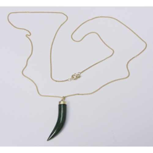 75 - A pendant comprising a jade 