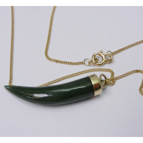 75 - A pendant comprising a jade 