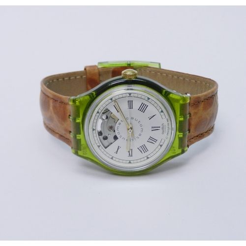 83 - A Swatch Automatic wristwatch comprising an ETA 2840 V8-V2B movement in a green acrylic case under a... 
