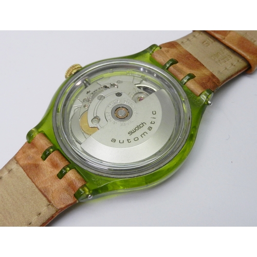 83 - A Swatch Automatic wristwatch comprising an ETA 2840 V8-V2B movement in a green acrylic case under a... 