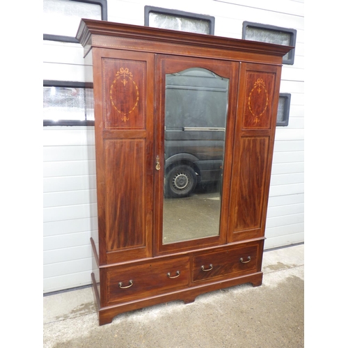 889 - An Edwardian mahogany & inlaid wardrobe with mirrored door, worm to back, 154cm wide