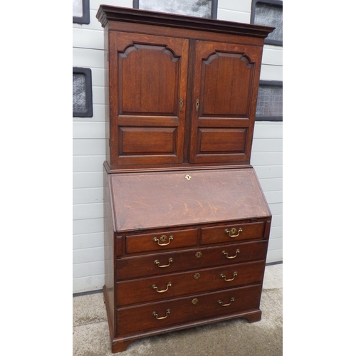 891 - A 19th cen oak bureau bookcase, 110cm wide