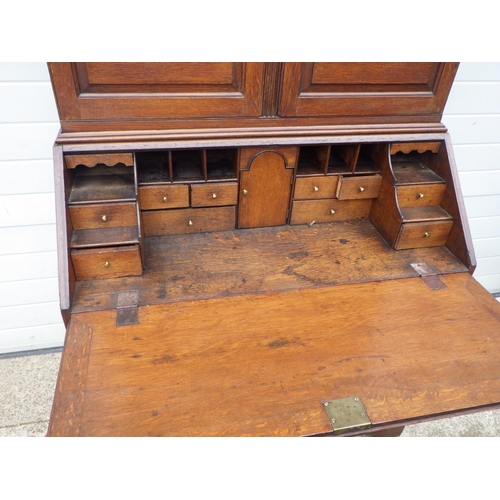 891 - A 19th cen oak bureau bookcase, 110cm wide