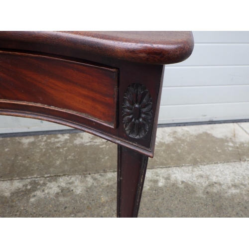 894 - A serpentine mahogany two drawer side table, 100cm wide