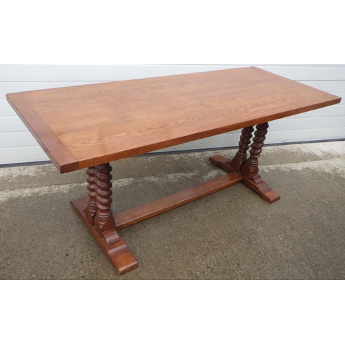 897 - An oak refectory table on barleytwist supports, 183cm x76cm