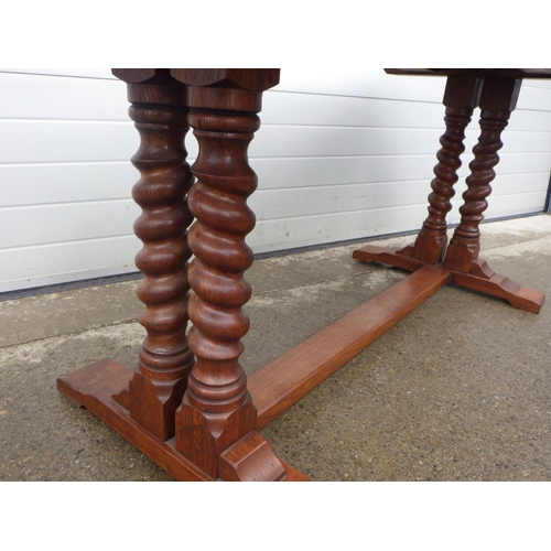 897 - An oak refectory table on barleytwist supports, 183cm x76cm