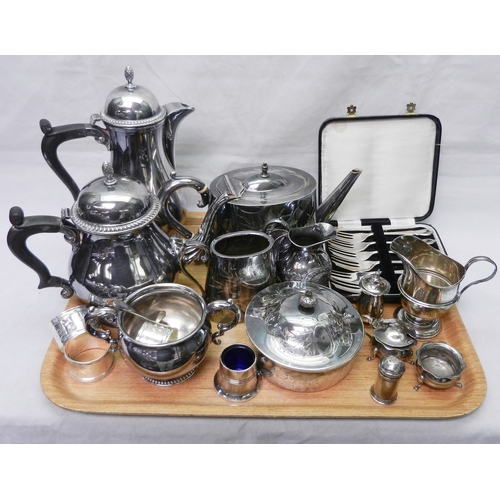 109 - A silver cream jug, 110mm tall, a silver three piece condiment set together with another silver pepp... 