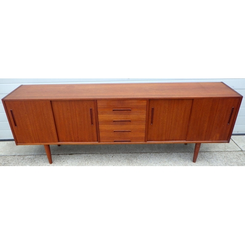 A Nils Jonsson Troeds teak long sideboard, 220cm long, back leg a/f