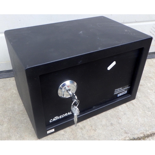 815 - A Cathedral small wall mounted safe, with key, 31cm wide