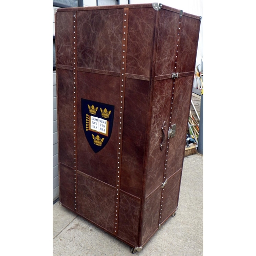 A Timothy Oulton folding unit, in the style of an oversized trunk, 193cm tall