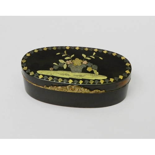 An oval case having a white and yellow metal floral inlaid hinged lid and unmarked yellow metal mounts, early 19th cent, 70mm across.  A/F cracks to case