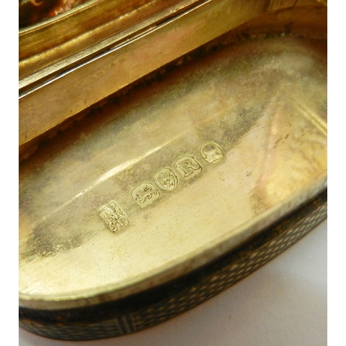 132 - A George III oval silver vinaigrette box, the sides and base engine turned, the top inlaid with an a... 