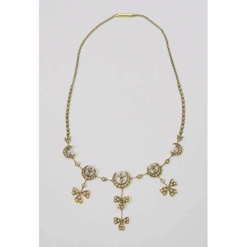 117 - A seed pearl articulated droplet necklace of crescent and clover design, unmarked yellow metal in Ed...